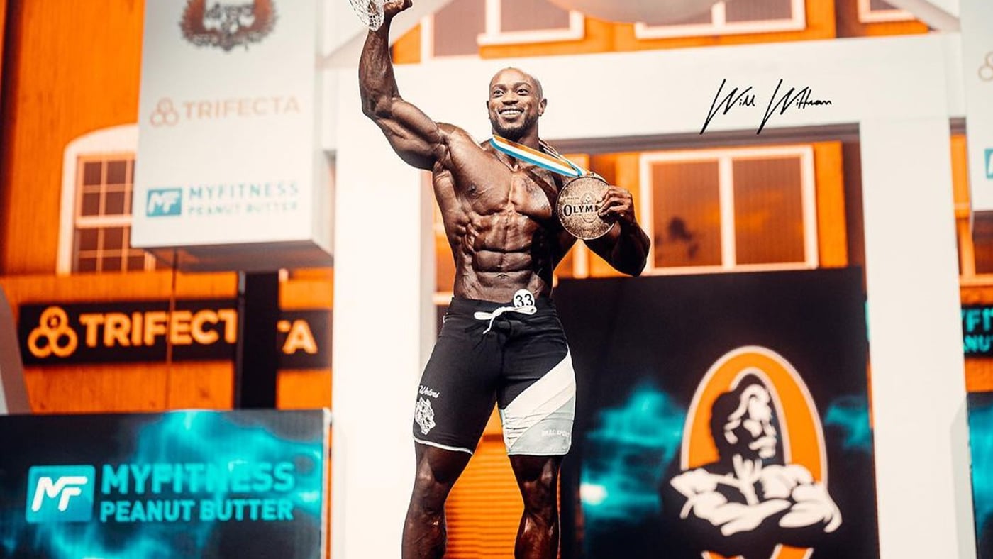 Brandon Hendrickson · Brandon Hendrickson raising his trophy at the 2021 Men’s Physique Olympia