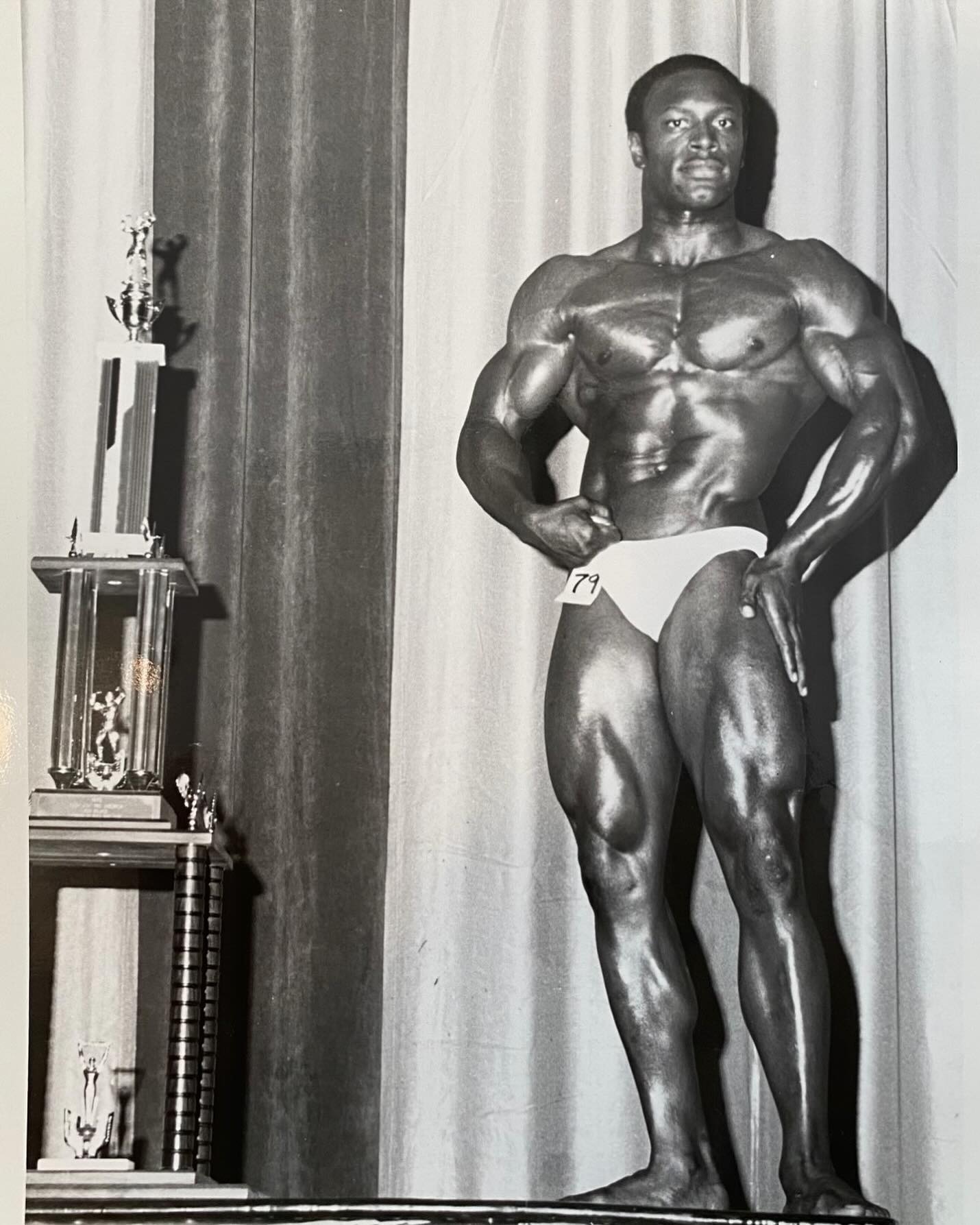 Lee Haney · Lee Haney on stage beside the trophies — official Instagram (@lee_haney_official)